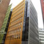 A modern multi-storey office building with a colourful facade